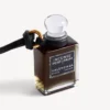 Fragrance miniature bottle charm in black Fragrance miniature bottle charm in black