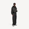 Men’s patched hooded jacket in black Men’s patched hooded jacket in black