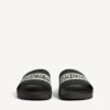 Men’s pool slide sandal in black/white Men’s pool slide sandal in black/white