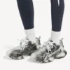 Women’s track stencil logo sneaker in black/white